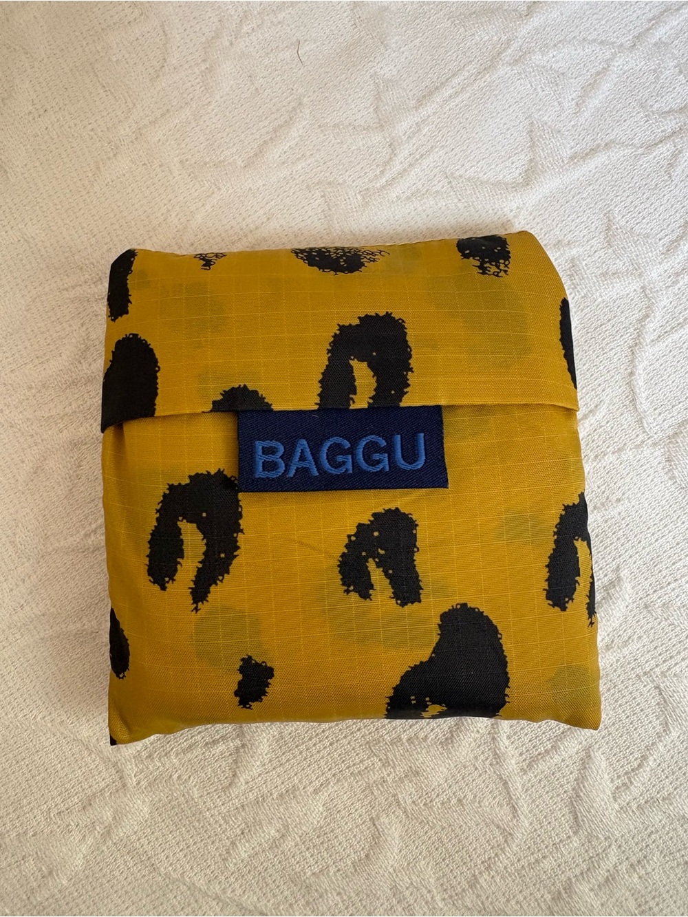 Baby BAGGU Foldable Tote in Mustard Yellow with Black Leopard Spots